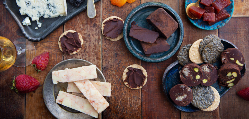 A smorgasbord of chocolate, fruit, wine, and cheese.