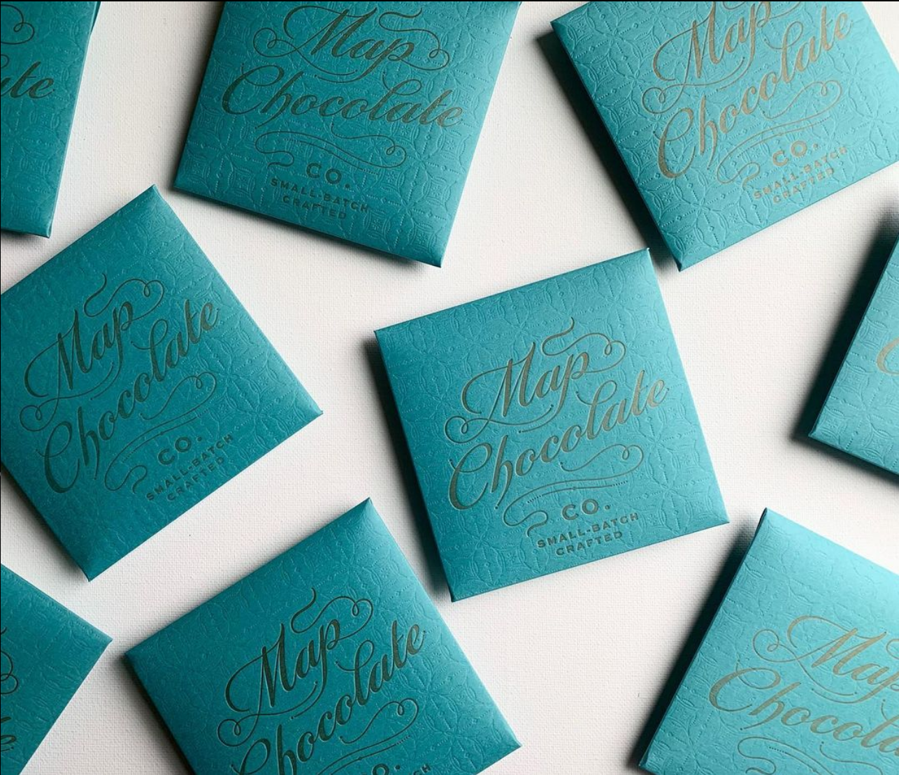Square Blue Map Chocolate Bar packages on a white background.