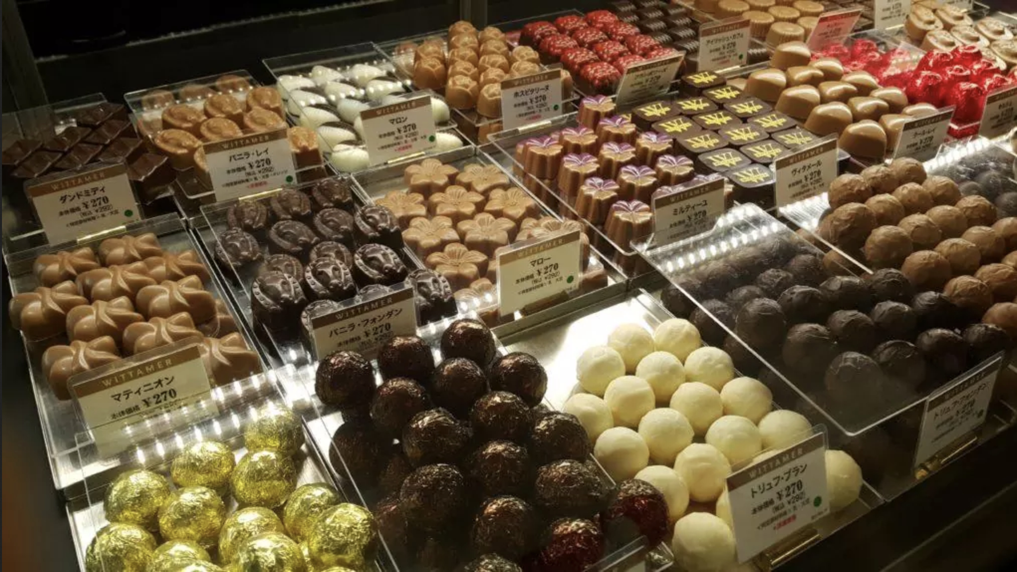 Japanese craft chocolate assortment on display in a craft chocolate shop.