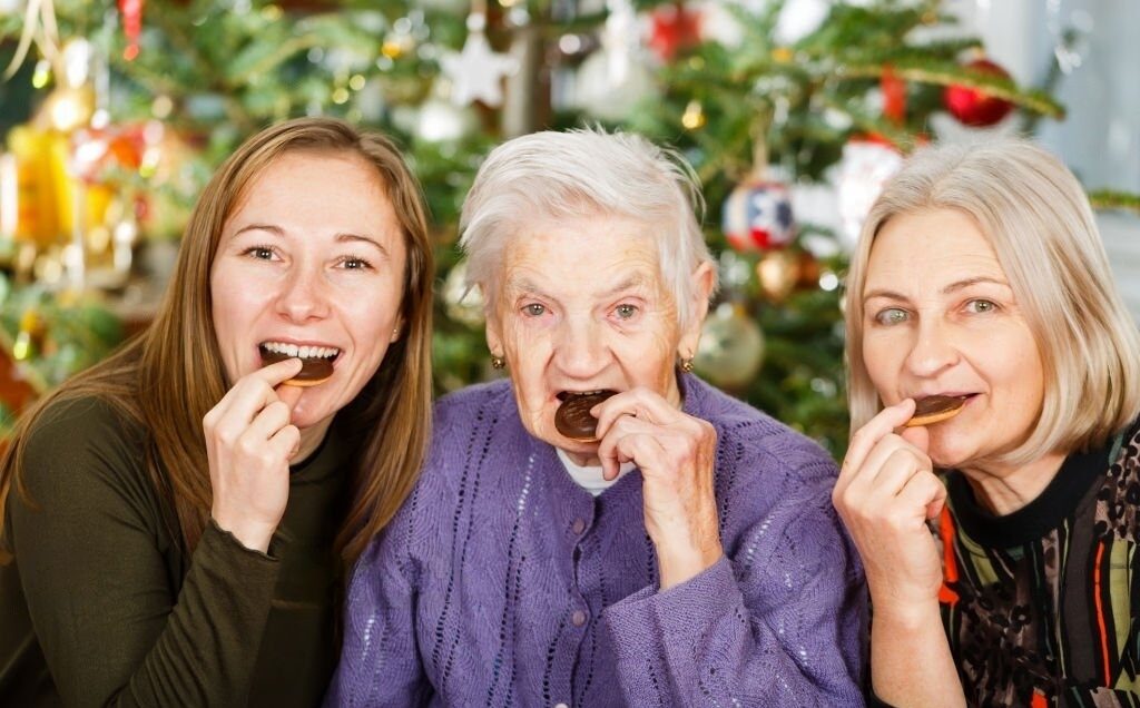Three generations eating chocolate together.
