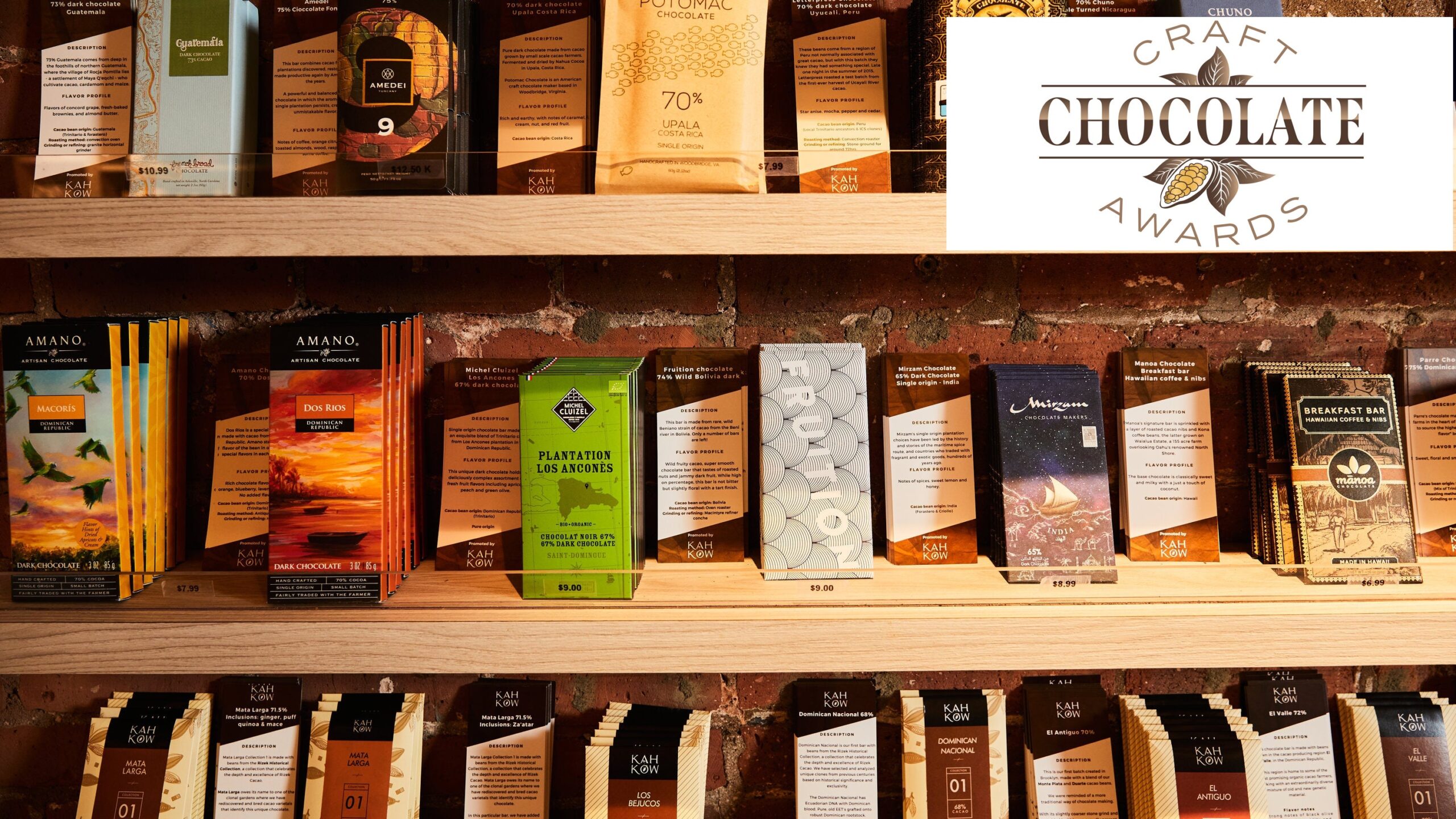 Bean-to-bar chocolate bars with beautiful wrappers on a wooden shelf.
