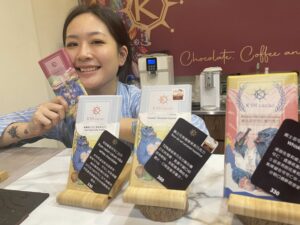 K'in Cacao founder Angela Yang posing with some of the shop's delicious chocolate.